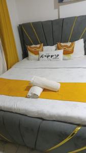 a pair of beds in a room with at Heritage Homes in Ruiru