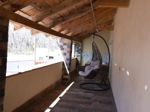 a room with a hammock hanging from a ceiling at Hotel Casa Patrón Parras in Parras de la Fuente