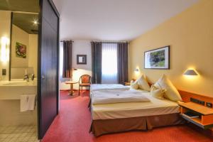 Кровать или кровати в номере Hotel Lehmeier