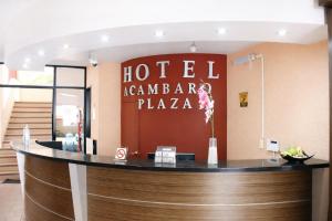 a hotel bar with a sign that reads hotelegaega plaza at Hotel Acámbaro Plaza in Acámbaro
