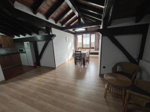 a kitchen and dining room with a table and chairs at CASA RURAL ETXANO in Amorebieta-Etxano