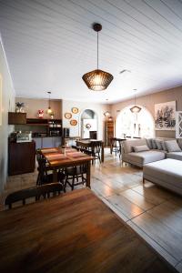 a living room with a couch and a table at Pousada João e Maria Gramado in Gramado