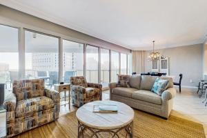 a living room with a couch and chairs and a table at TOPS'L Tides in Destin