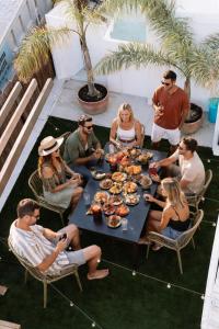 a group of people sitting around a table at Outsite Ibiza - Work, Connect, Explore in Es Cana +73 photos