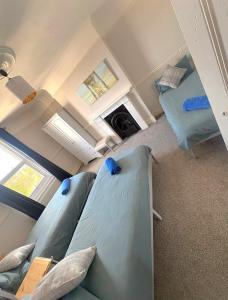 a room with three bunk beds in it at Lennox Lodge 2 in Portsmouth