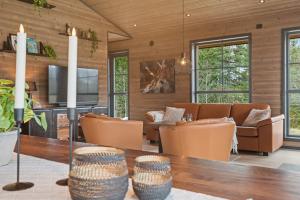 a living room with a table and chairs at Stryn Mountain Lodge in Stryn