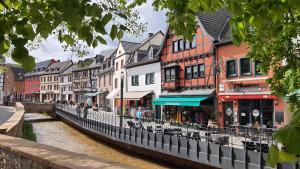 a town with a river and buildings next to a canal at Fewo Lieblingsblick, gemütlich & chic in Bad Münstereifel