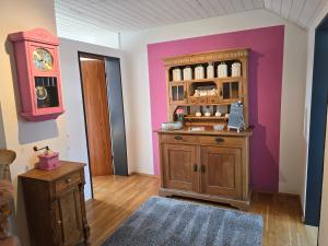 a room with a wooden cabinet and a counter at Fewo Lieblingsblick, gemütlich & chic in Bad Münstereifel