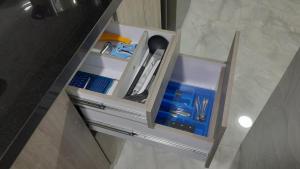 a cabinet with some items in it in a bathroom at El Encanto in Duitama