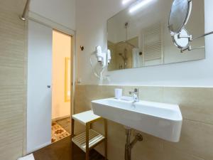 a bathroom with a sink and a mirror at Moro Guest House in Lecce +110 photos