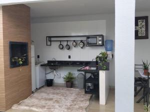 a kitchen with a counter and a microwave and a table at 3 A A a in Sinop +19 photos
