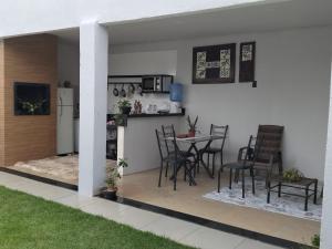 a patio with a table and chairs and a kitchen at 3 A A a in Sinop