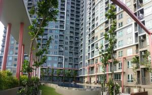 an apartment complex with tall buildings at Rich Park@Tao poon interchange in Bang Su