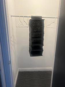 a rack of black towels in a closet at The millstone residents in Bradford