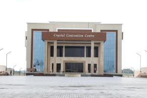 a building with a sign that reads crystals convention center at Crystal Residency - Panjappur Trichy in Pūngudi