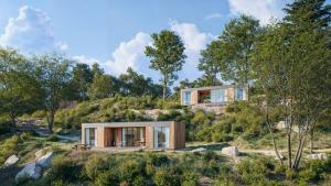 a house on top of a hill with trees at L'Acciola in Evisa