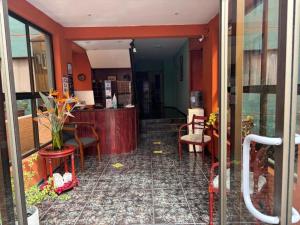 a lobby of a restaurant with chairs and a counter at DUNA Apart Hotel in Copiapó