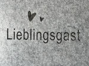 a piece of paper with the word liberalismost with hearts at Ferienwohnung Erhol Dich Gut in Diez