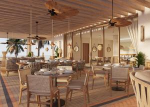a restaurant with wooden ceilings and tables and chairs at Secrets Playa Mujeres Golf & Spa Resort - All Inclusive Adults Only in Cancún
