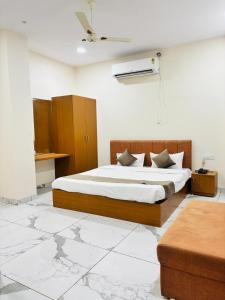 a bedroom with a bed in a room with at Hotel Venus Stays Near Prestige College Bhopal in Bhopal