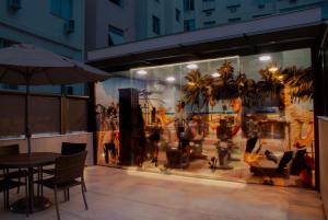 a store window with mannequins in a store at Hotel Astoria Copacabana in Rio de Janeiro