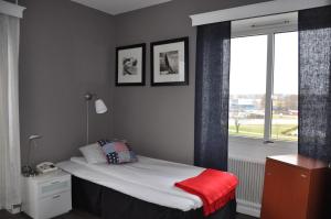 Letto o letti in una camera di Strand Hotell