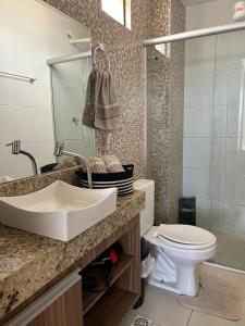 a bathroom with a sink and a toilet at Boulevard Plaza Flat Mirante Apto 201 in Campina Grande