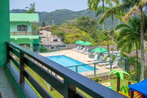 a view of the pool from the balcony of a resort at Marencanto Pousada in Ubatuba