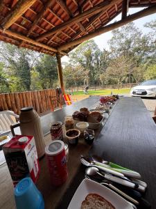 a wooden table with food on top of it at Rancho300 - Quiriri - Joinville in Joinville