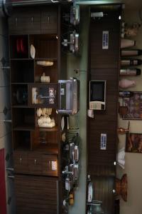 a room with a door and a shelf with food at Lagos Hotel in Itajubá +30 photos
