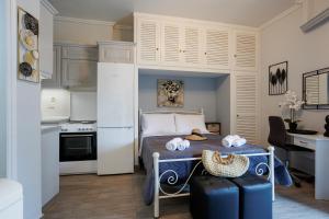 a bedroom with a bed with towels on it at Corfu Bay Serenity Suite in Ágios Rókkos +14 photos