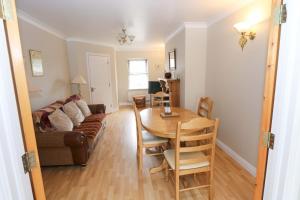 a living room with a table and a couch at Aisling in Foxford