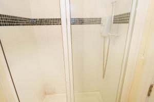 a shower with a glass door in a bathroom at Aisling in Foxford +11 photos