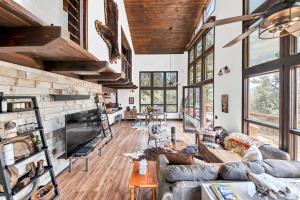 a living room with a couch and a fireplace at Authentic 4BR Big Bear Cabin, Dog-Friendly with Deck in Big Bear City