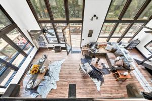 an overhead view of a living room with wood floors and windows at Authentic 4BR Big Bear Cabin, Dog-Friendly with Deck in Big Bear City