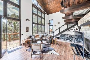 a living room with a couch and a fireplace at Authentic 4BR Big Bear Cabin, Dog-Friendly with Deck in Big Bear City