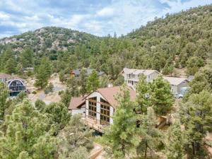 an aerial view of a house with a mountain at Authentic 4BR Big Bear Cabin, Dog-Friendly with Deck in Big Bear City