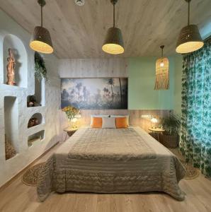 a bedroom with a large bed and two lamps at Mayachok Boutique hotel in Kyiv +27 photos