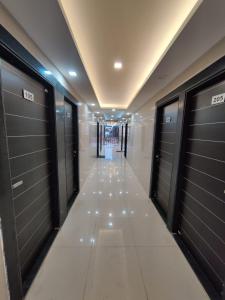 a hallway with lockers in a building at 7 Vachan Garden and Resort in Bhopal