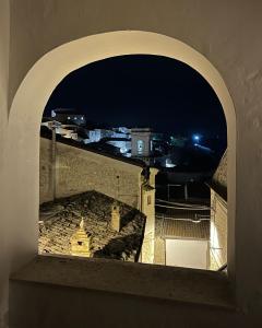 a view of a city from a window at night at Il Poggetto Bed and Breakfast in Bovino