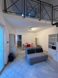 a bedroom with a bed and a table in a room at Le Tre Capanne in Marina di Carrara