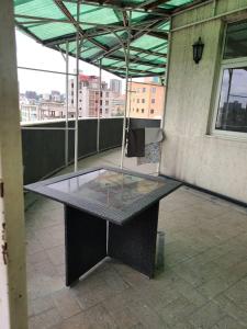 a table on top of a building with a window at Aster Mekuria in Addis Ababa