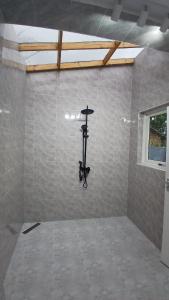 a room with a wall with a camera in it at Jacaranda Home in Mbeya