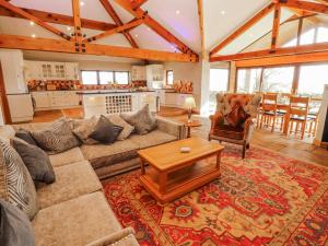 a living room with a couch and a coffee table at Old Riggs Paddock in Penrith