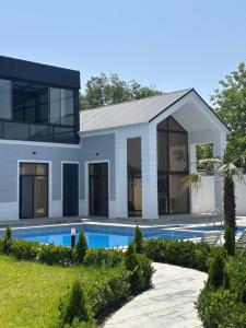 a rendering of a house with a swimming pool at Palmen Villa Gabala in Gabala