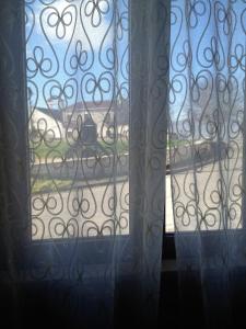 a view of a window with a view of a yard at B&B La Torre in Rosello