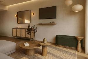 a living room with a couch and a table at Hotel Core Suites Estadio Akron in Zapopan