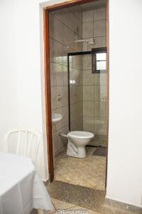 a bathroom with a toilet and a shower at Hotel Estação Trem Guararema in Guararema +14 photos