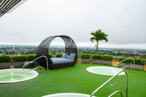 a garden with a couch on the roof of a building at GHL Hotel Grand Villavicencio in Villavicencio +84 photos