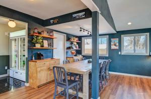 a dining room with a wooden table and chairs at Loyal Duke Lodge in Salida